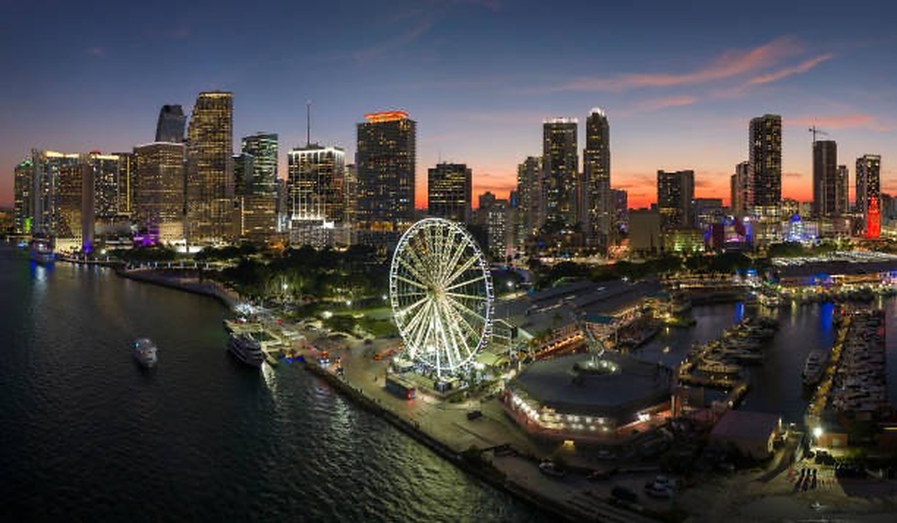 Miami-Dade County, Florida skyline and waterfront at dusk